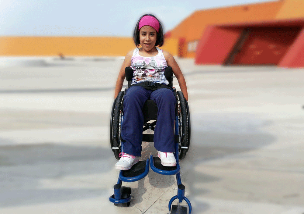 a young girl in a wheelchair