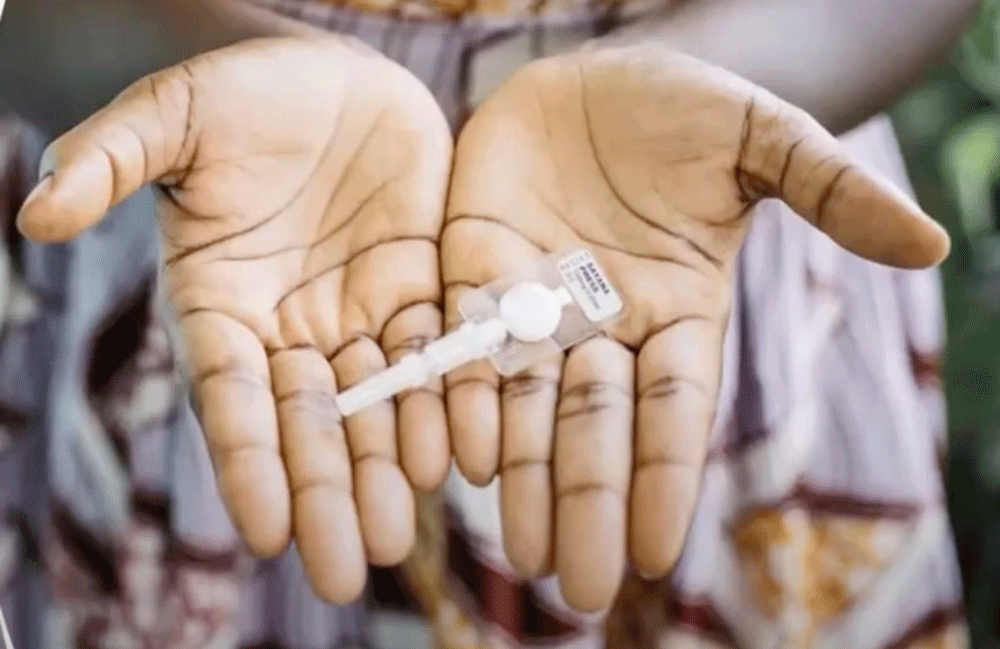 hands holding a Self Injectable Contraceptive device.